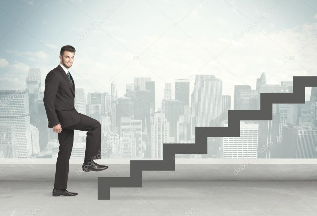 Business person in front of a staircase