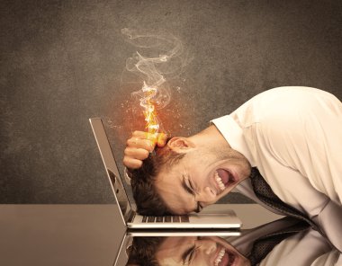 Sad business person's head catching fire clipart