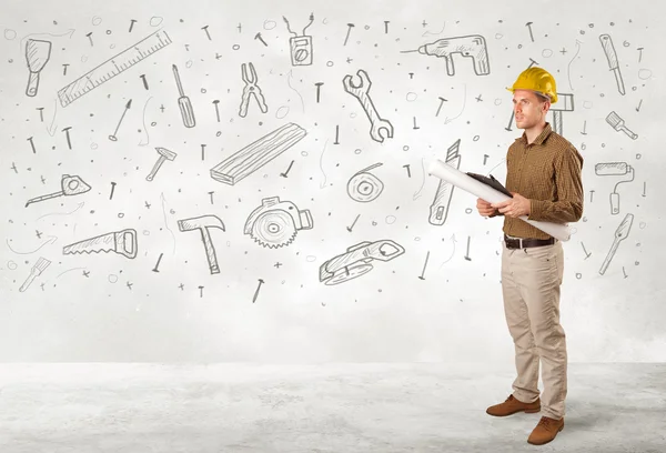 Construction worker planing with hand drawn tool icons — Stock Photo, Image