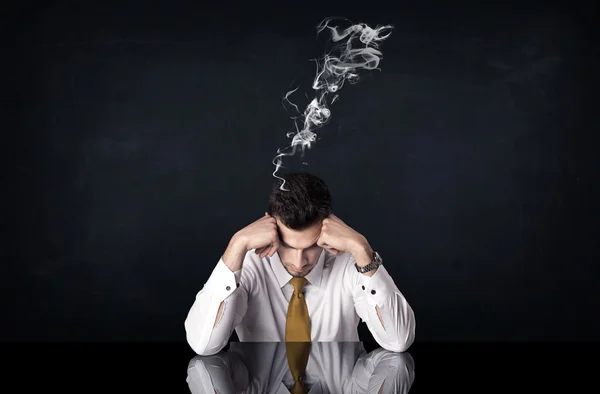 Depressed businessman with smoking head — Stock Photo, Image