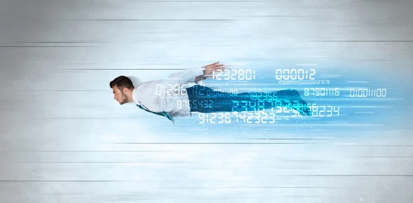 Businessman flying super fast with data numbers left behind — Stock Photo, Image