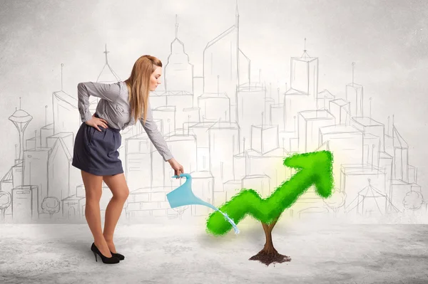 Business woman watering green plant arrow — Stock Photo, Image