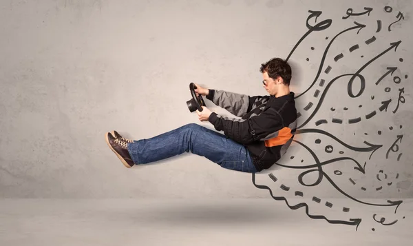 Funny man driving a flying vehicle with hand drawn lines after h — Stock Photo, Image