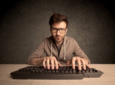 Computer geek typing on keyboard clipart