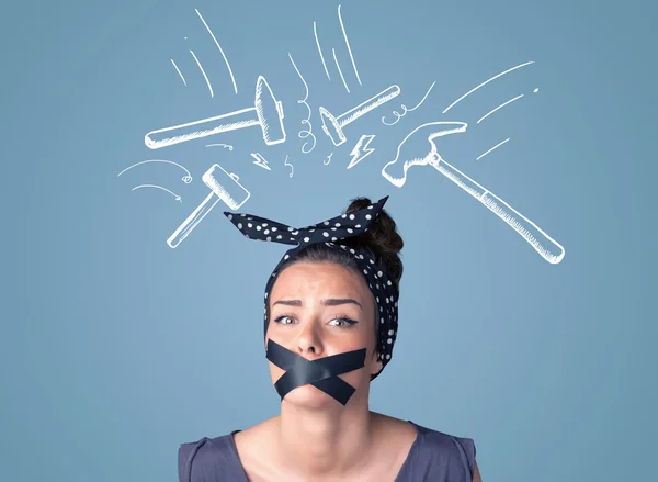 Young woman with glued mouth and hammer marks — Stock Photo, Image