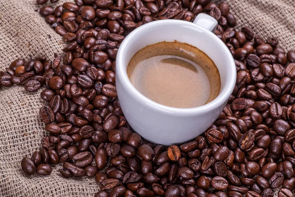 Cup of coffee and beans Royalty Free Stock Photos