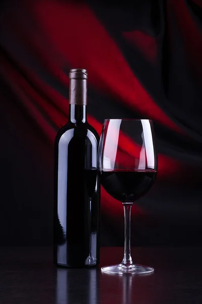 Red wine glass and bottle — Stock Photo, Image