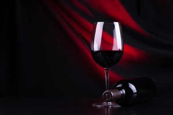 Red wine glass and bottle — Stock Photo, Image