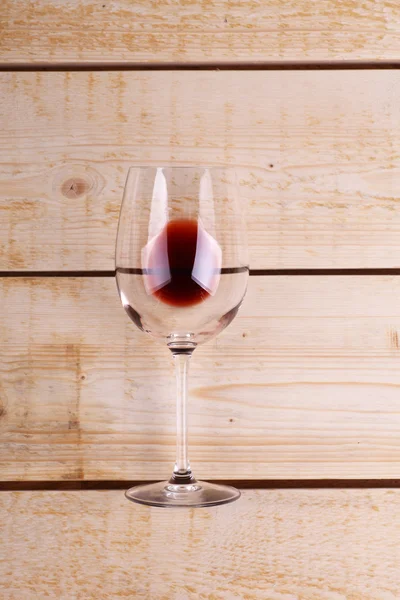 Glass of red wine on wood — Stock Photo, Image