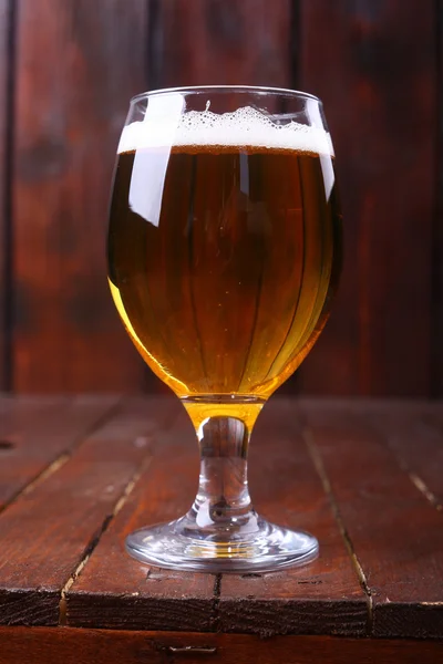 Glass of beer on wood — Stock Photo, Image