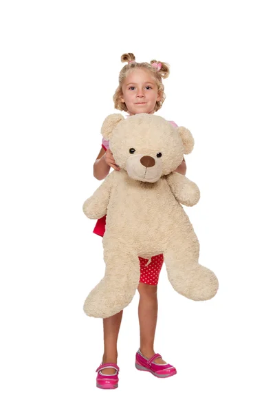 Little girl playing with teddy bear — Stock Photo, Image