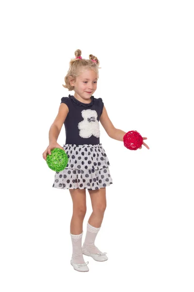 Little girl with colored balls — Stock Photo, Image