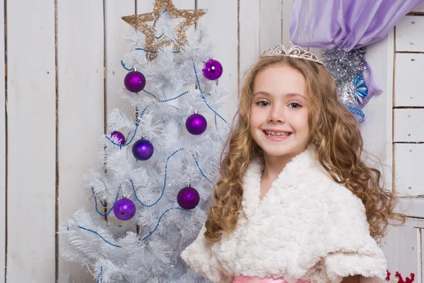 Little girl over fir tree — Stock Photo, Image