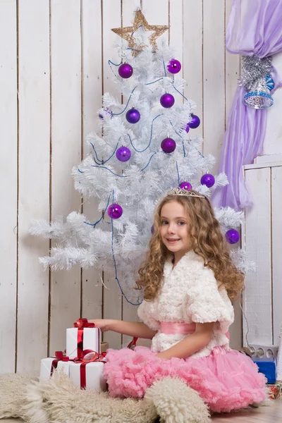 Little girl with christmas presents — Stock Photo, Image