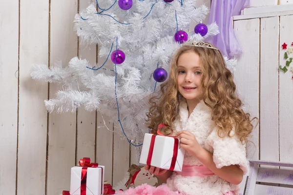 Little girl with christmas presents — Stock Photo, Image