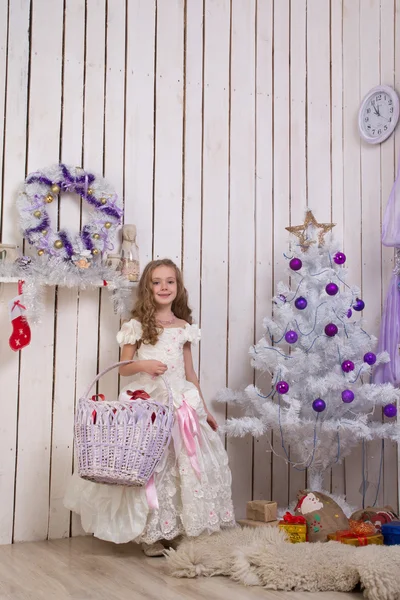 Little girl over fir tree — Stock Photo, Image