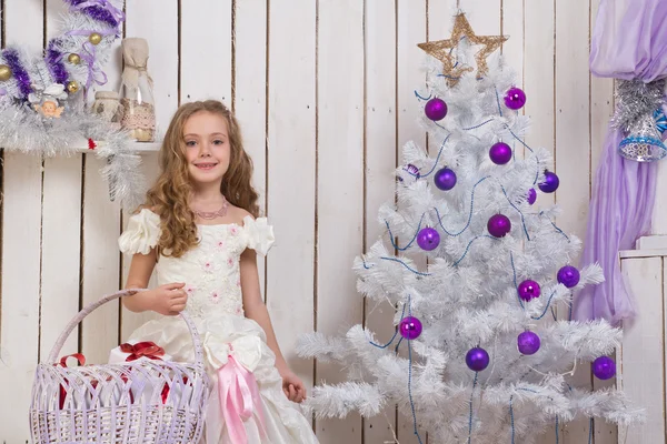 Little girl over fir tree — Stock Photo, Image