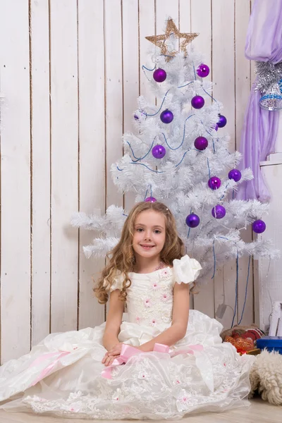 Little girl over fir tree — Stock Photo, Image