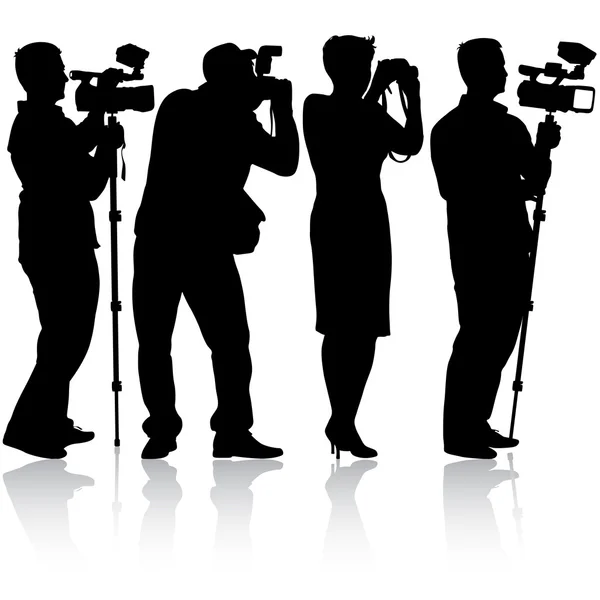 Cameraman with video camera. Silhouettes on white background. — Stock Vector