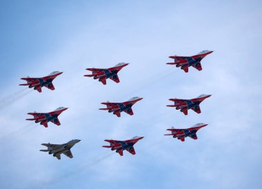 Moscow Russia Zhukovsky Airfield 31 August 2019: aerobatic team swifts MiG-29 perfoming demonstration flight of the international aerospace salon MAKS-2019. clipart