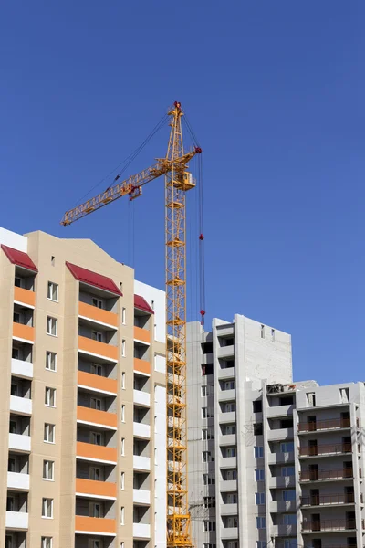 Industrial landscape, building crane against the blue sky — Stock Photo, Image