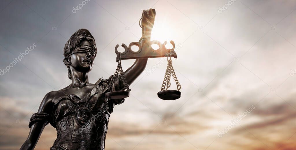 Close up of lady justice, Themis bronze figure over the sky background with copy space