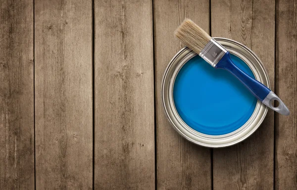 Paint can on the grunge wooden background with copy space — Stock Photo, Image
