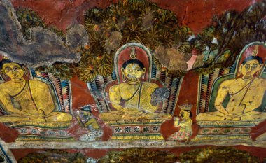 Mulkirigala, Sri Lanka - Nov 4, 2017: Fresco inside old Buddhist temple, wall painting with Buddha images. Traditional indian religious art. Colorful temple interior. Concept of travel in Sri Lanka.