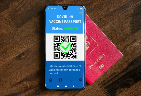 Health passport of COVID-19 vaccination in mobile phone for travel, digital passport app in smartphone. Certificate as proof of coronavirus immunization. Corona vaccine pass due to COVID pandemic.