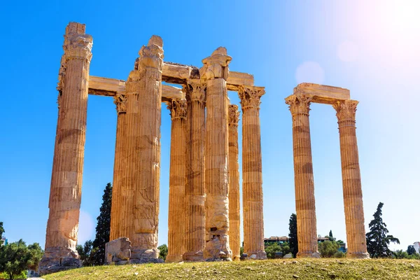 Temple of Olympian Zeus in Athens, Greece, Europe. Ancient building of Zeus is famous landmark of old Athens. Sunny view of classical Greek ruins on blue sky background. History and culture concept.