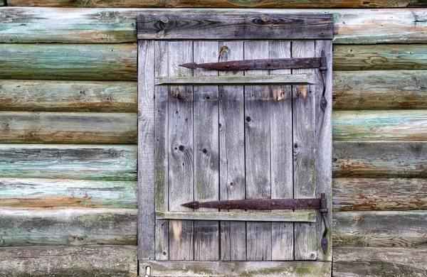 Old log house wall with a door — Stock Photo, Image