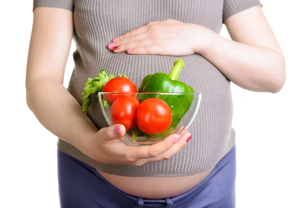 Schwangere hält frisches Gemüse in der Hand — Stockfoto