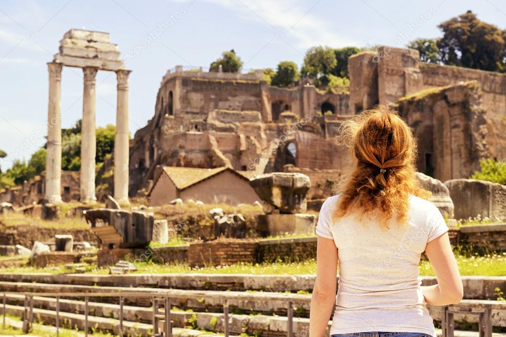 Female tourist on the ruins of the Roman Forum, Rome