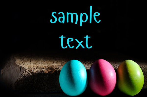 easter color eggs on white with place for sample text