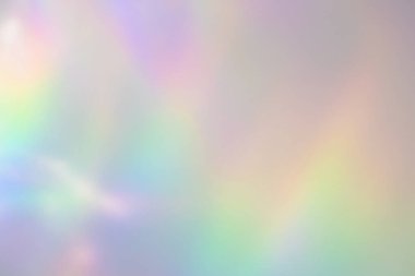 Beyaz duvarda bulanık gökkuşağı ışık kırılması dokusu