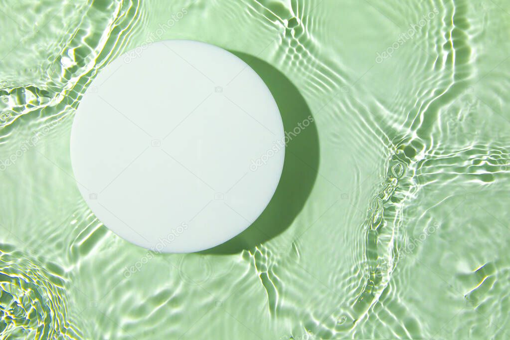 Empty white circle podium on transparent green clear water background
