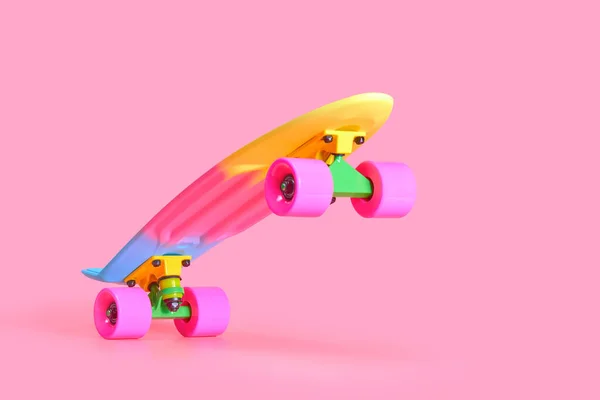 Szivárvány műanyag Penny board gördeszka elszigetelt rózsaszín háttér — Stock Fotó