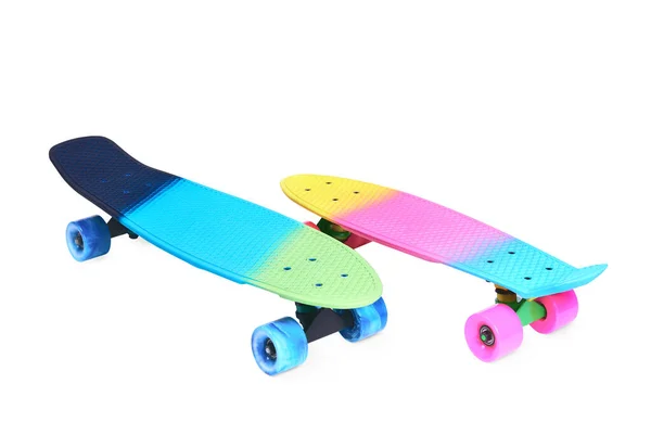 Two rainbow plastic Penny board skateboards on white background — Stock Photo, Image