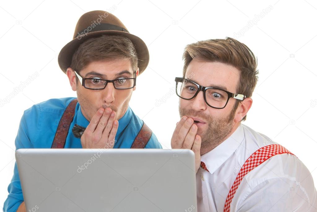 computer nerds looking at laptop