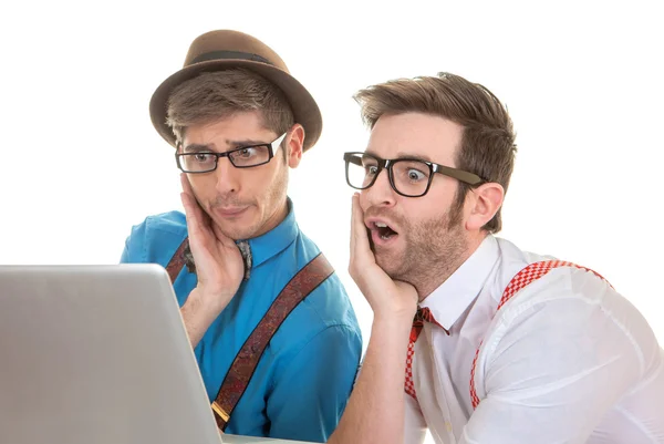 IT nerds looking at laptop computer — Stock Photo, Image