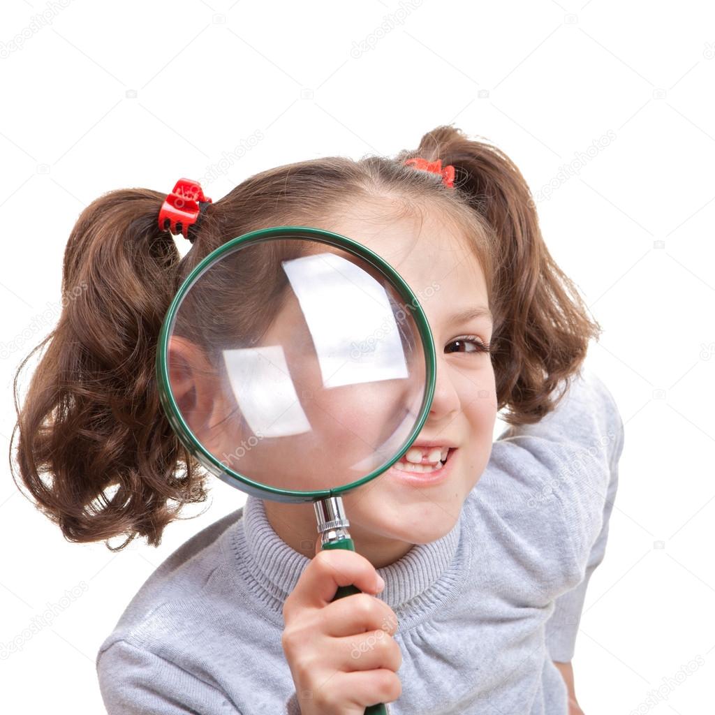 child with magnifying spy glass