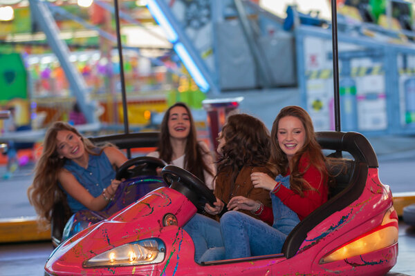 group of kids at funfair or fairground