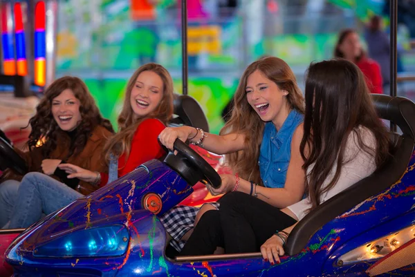 Carnival bumper ride group of teens — Stock Photo, Image