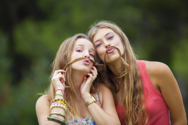 healthy young teens goofing about.  clipart