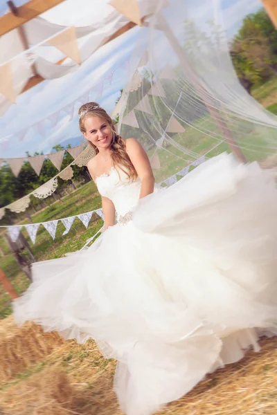 Happy bride twirling in wedding dress. — Stock Photo, Image