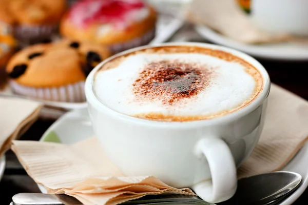 Hot drink,cappuccino coffee on table — Stock Photo, Image