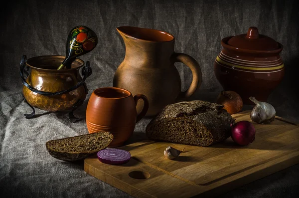 Still life with homemade bread and pottery Stock Photo