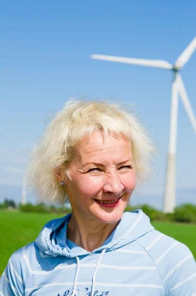 Portrait of a middle-aged woman on the background of wind-driven — Stock Photo, Image