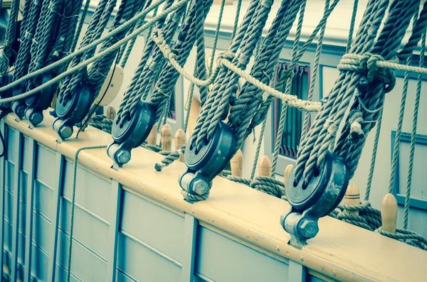 Blocks and rigging of an old sailboat, close-up, toning — Stock Photo, Image