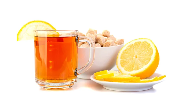 Cup of black tea with lemon, lemon on a saucer, brown sugar. — Stock Photo, Image